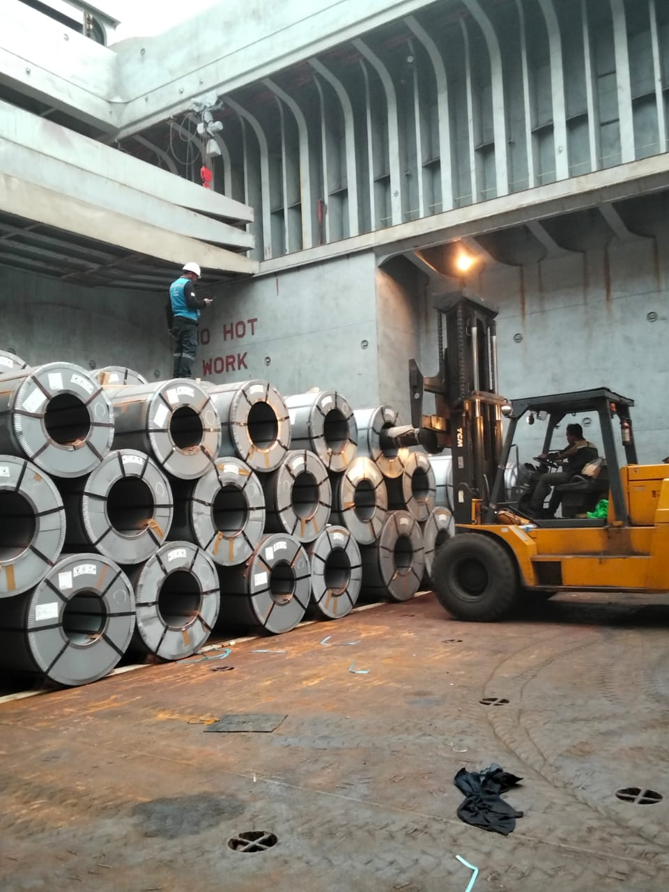 Efficient cargo arrangement of steel coils inside the ship’s hold, ensuring secure and organized stowage